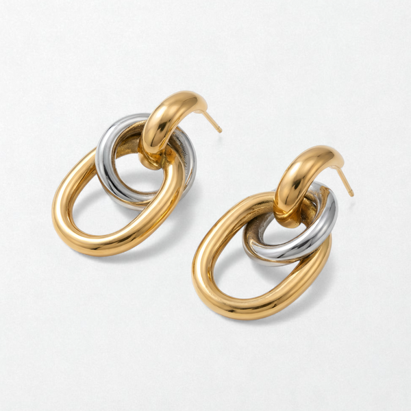 Pair of Livia duo tone interlocking link earrings: polished gold hoops holding silver and gold oval links