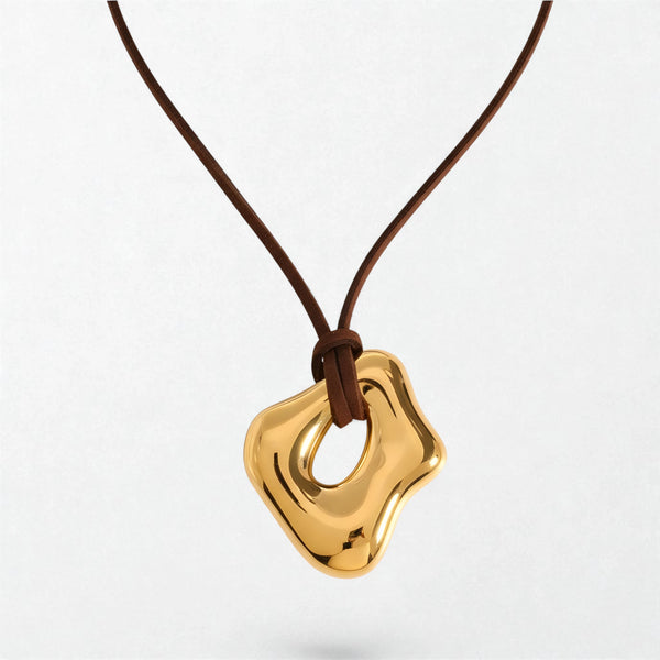 Seraphina sculptural cord pendant necklace in 18K gold-plated waterproof stainless steel, a glossy open organic shape on brown cord