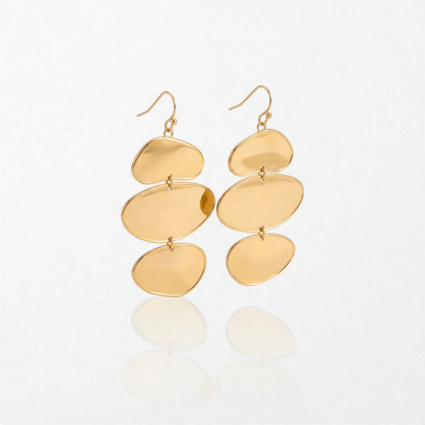 Pair of Greta sculptural triple disc drop earrings in 18K gold-plated waterproof stainless steel, three stacked gold discs on hooks