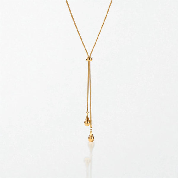 Elodie Y lariat necklace in 18K gold-plated waterproof stainless steel: a fine snake chain through a slider bead, ending in two teardrops