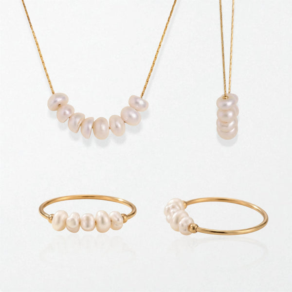 Alva and Astrid pearl set in 18K gold-plated waterproof stainless steel: a pearl cluster necklace and a pearl stacking ring