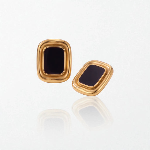 Pair of Sabine statement stud earrings: glossy black rectangular panels in thick, rounded 18K gold-plated stainless steel frames