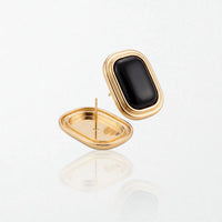 Sabine black square stud earrings shown front and back, with the hollow gold back and post