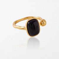 Odile black stone open ring from a second angle, showing the gold open band