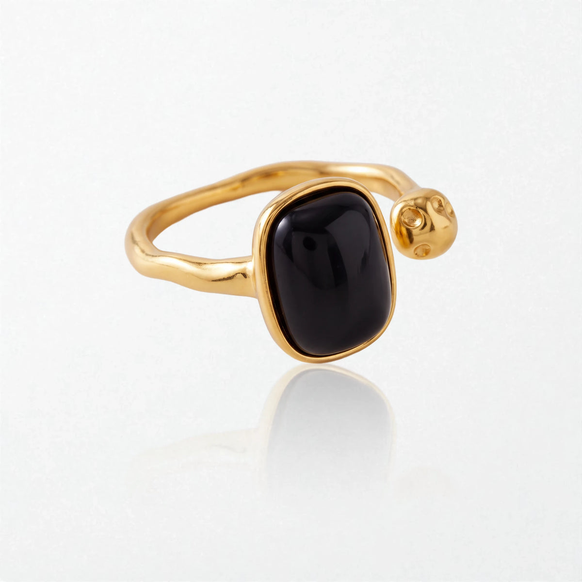 Odile black stone open ring from a second angle, showing the gold open band