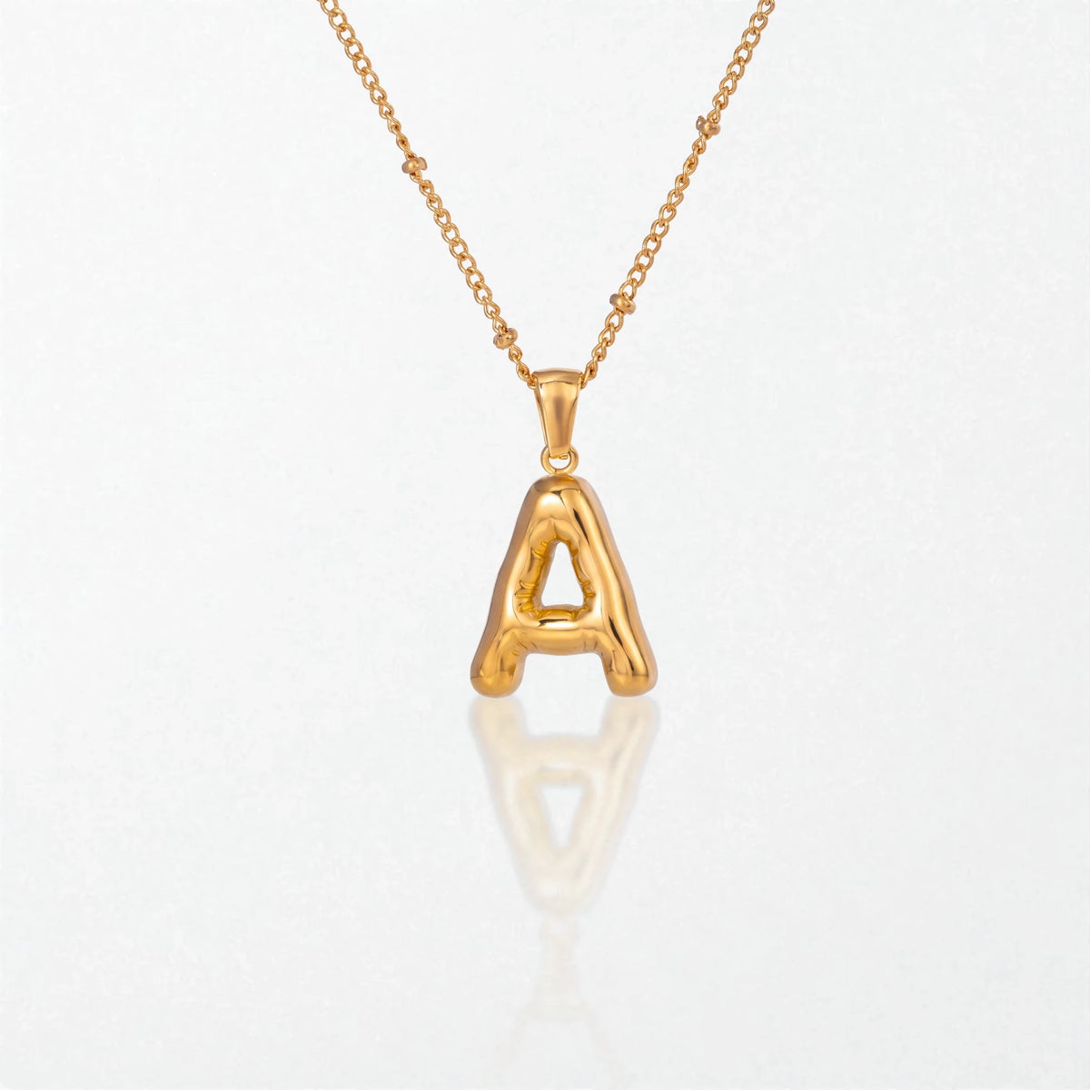 Bubble initial necklace with letter A pendant in 18K gold plated stainless steel, on a satellite chain