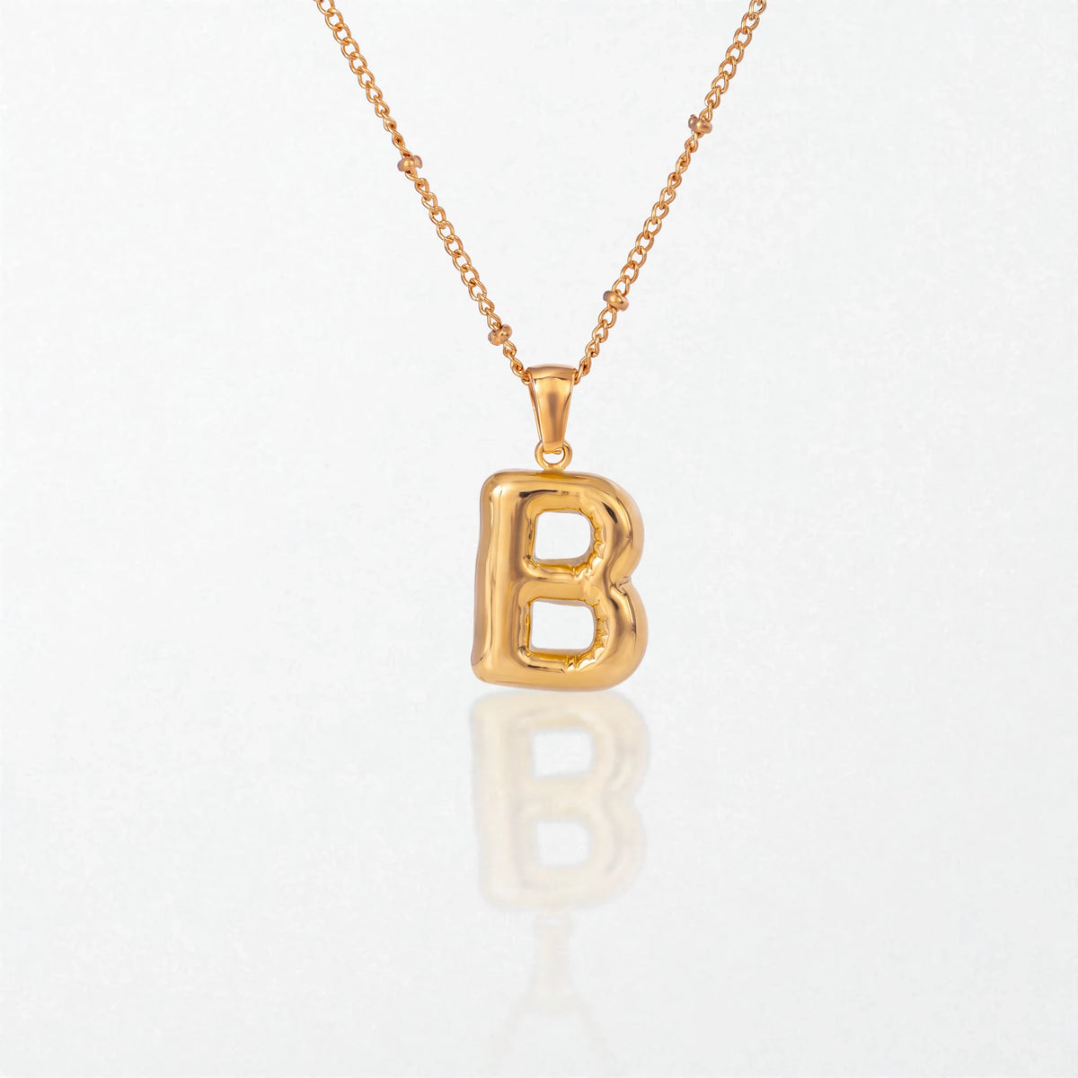 Bubble initial necklace with letter B pendant in 18K gold plated stainless steel, on a satellite chain
