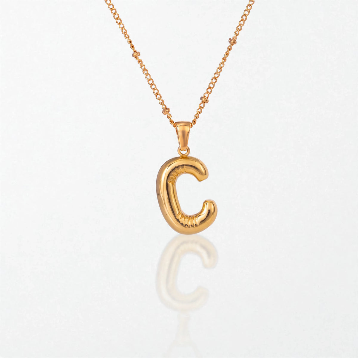 Bubble initial necklace with letter C pendant in 18K gold plated stainless steel, on a satellite chain