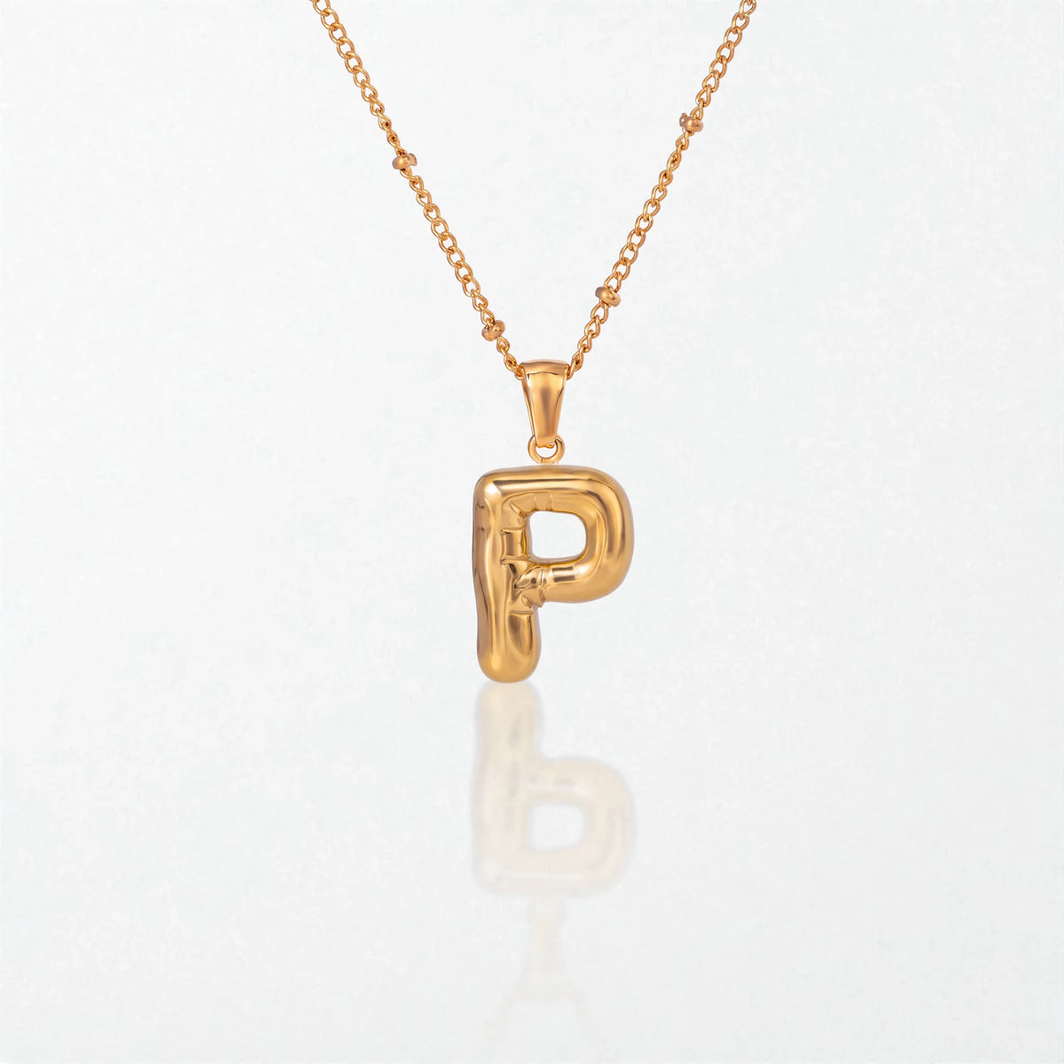 Bubble initial necklace with letter P pendant in 18K gold plated stainless steel, on a satellite chain