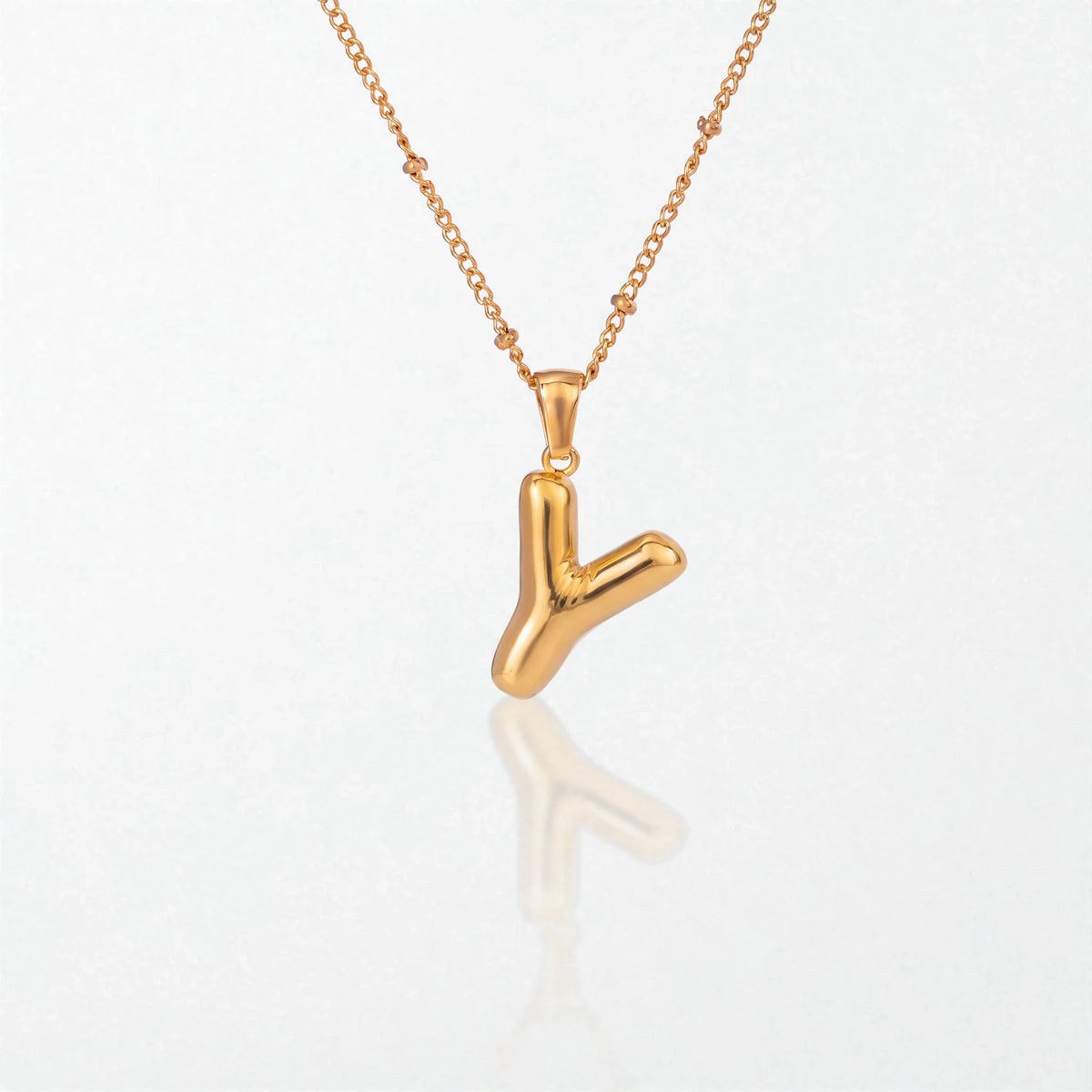 Bubble initial necklace with letter Y pendant in 18K gold plated stainless steel, on a satellite chain