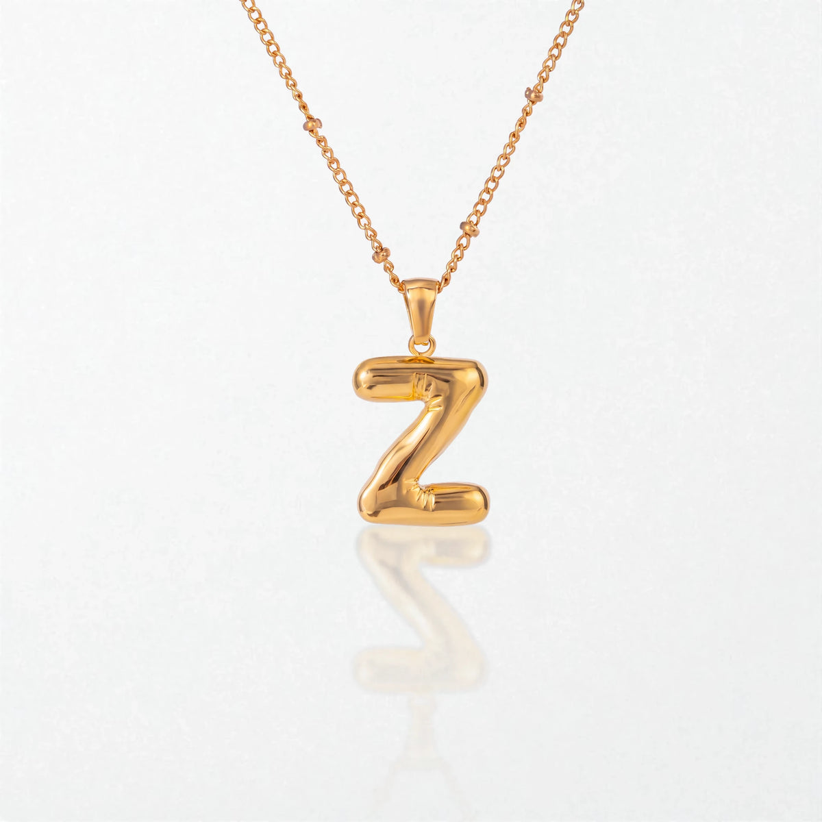 Bubble initial necklace with letter Z pendant in 18K gold plated stainless steel, on a satellite chain