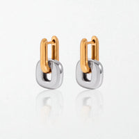 Pair of Edie square link hoop earrings in duo tone: 18K gold hinged hoops holding polished silver square links