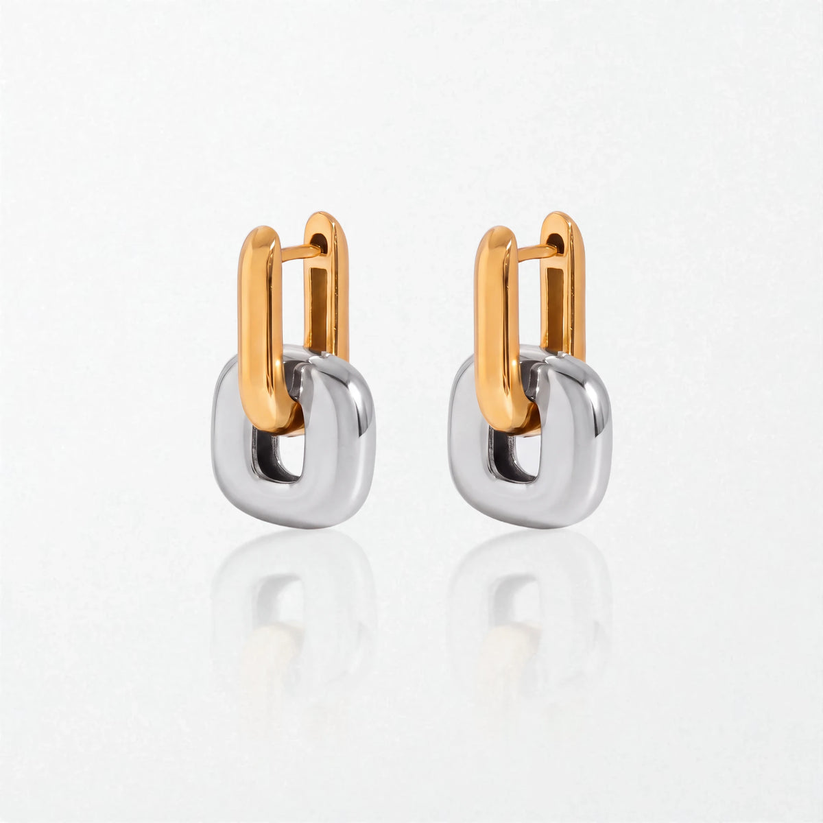Pair of Edie square link hoop earrings in duo tone: 18K gold hinged hoops holding polished silver square links