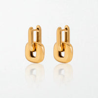 Pair of Edie chunky hoop earrings in 18K gold-plated waterproof stainless steel: a hinged U-shaped hoop holding a puffy square link