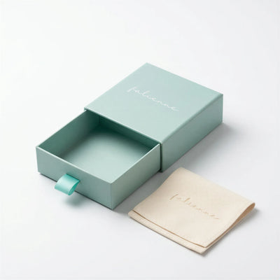 The Falienne Signature Sage Gift Box with a cream velvet pouch