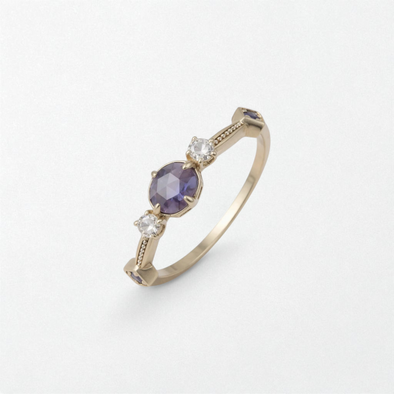 Gold ring with a purple gemstone and cubic zirconia stones on a white background