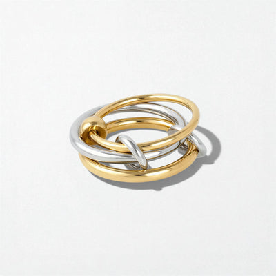 Harmony intertwined link rings in duo tone: three linked bands, two in gold and one in silver, stacked together