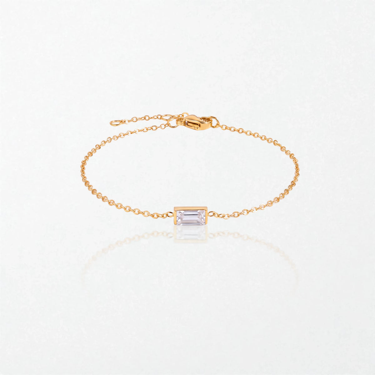 Juno birthstone bracelet in 14K gold-plated waterproof stainless steel with a small baguette clear crystal stone for April