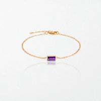 Juno birthstone bracelet in 14K gold-plated waterproof stainless steel with a small baguette amethyst purple stone for February