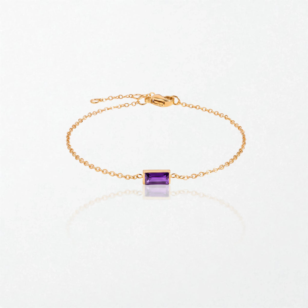 Juno birthstone bracelet in 14K gold-plated waterproof stainless steel with a small baguette amethyst purple stone for February