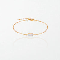 Juno birthstone bracelet in 14K gold-plated waterproof stainless steel with a small baguette opal white stone for October