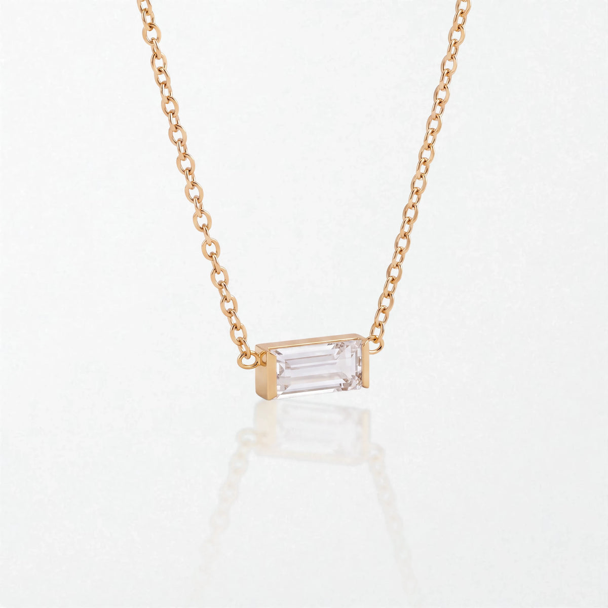 Juno birthstone necklace in 14K gold-plated waterproof stainless steel with a small baguette clear crystal stone for April