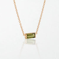 Juno birthstone necklace in 14K gold-plated waterproof stainless steel with a small baguette peridot green stone for August
