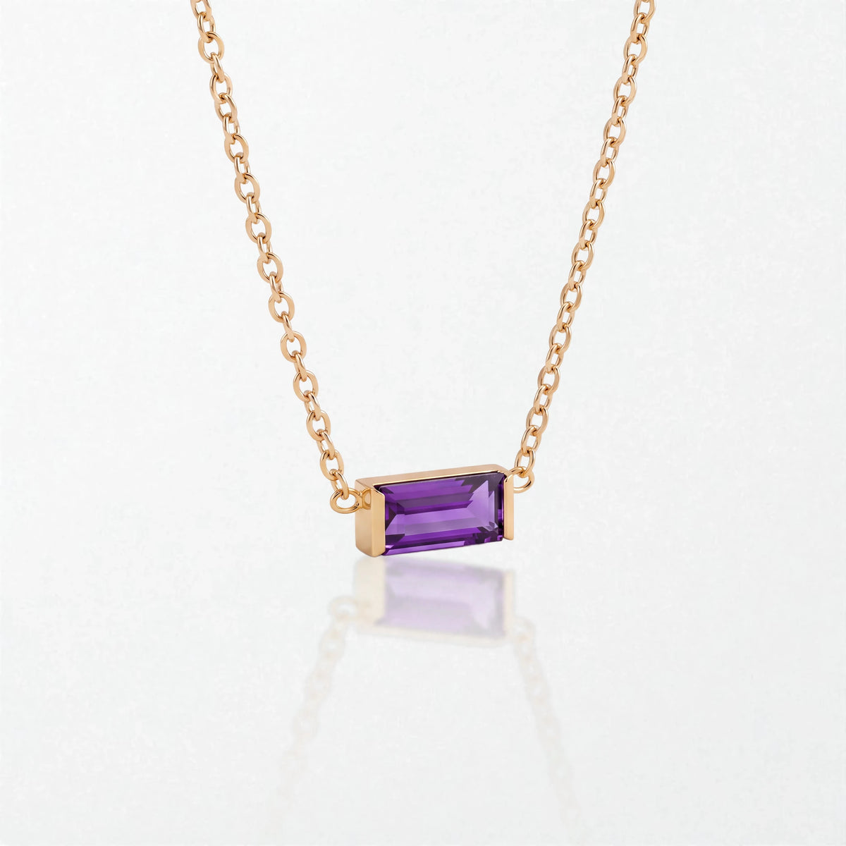 Juno birthstone necklace in 14K gold-plated waterproof stainless steel with a small baguette amethyst purple stone for February