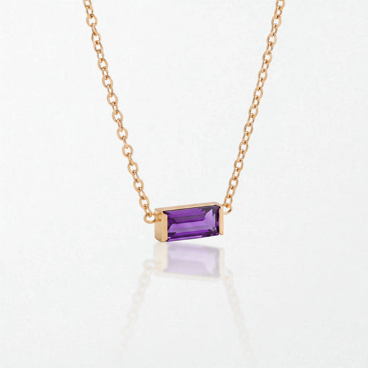 Juno birthstone necklace in 14K gold-plated waterproof stainless steel with a small baguette amethyst purple stone for February