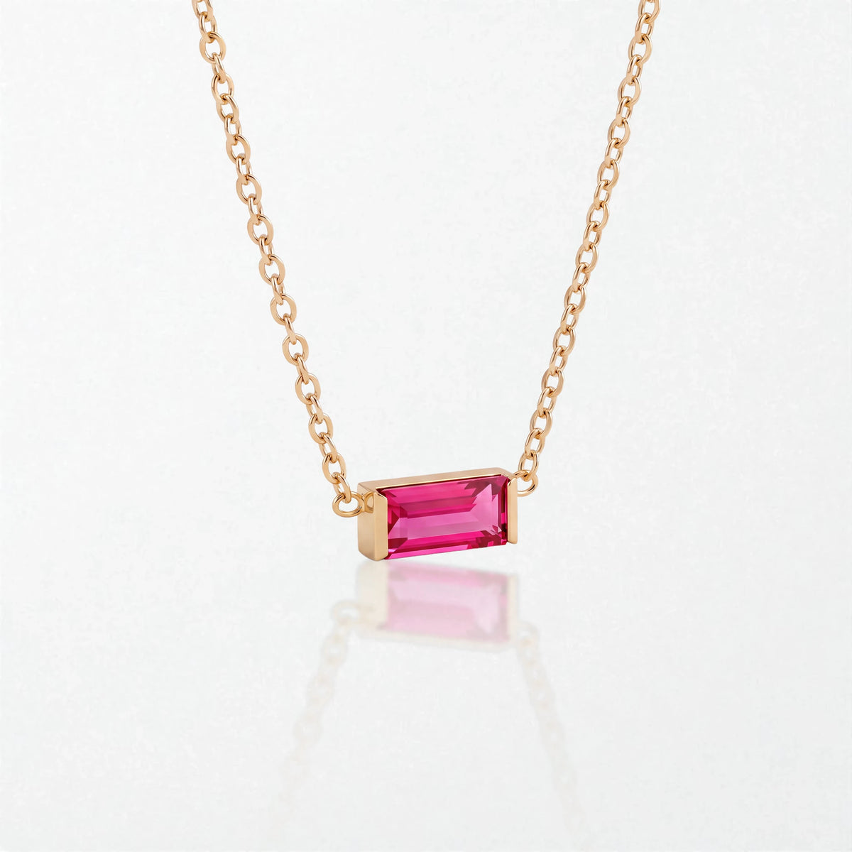Juno birthstone necklace in 14K gold-plated waterproof stainless steel with a small baguette ruby red stone for July