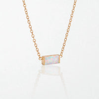 Juno birthstone necklace in 14K gold-plated waterproof stainless steel with a small baguette opal white stone for October