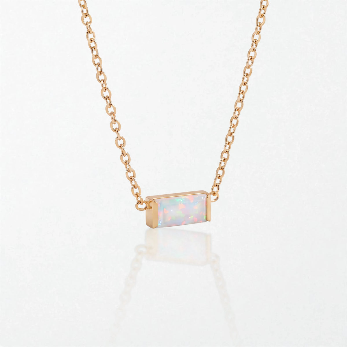 Juno birthstone necklace in 14K gold-plated waterproof stainless steel with a small baguette opal white stone for October