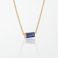 Juno birthstone necklace in 14K gold-plated waterproof stainless steel with a small baguette sapphire blue stone for September