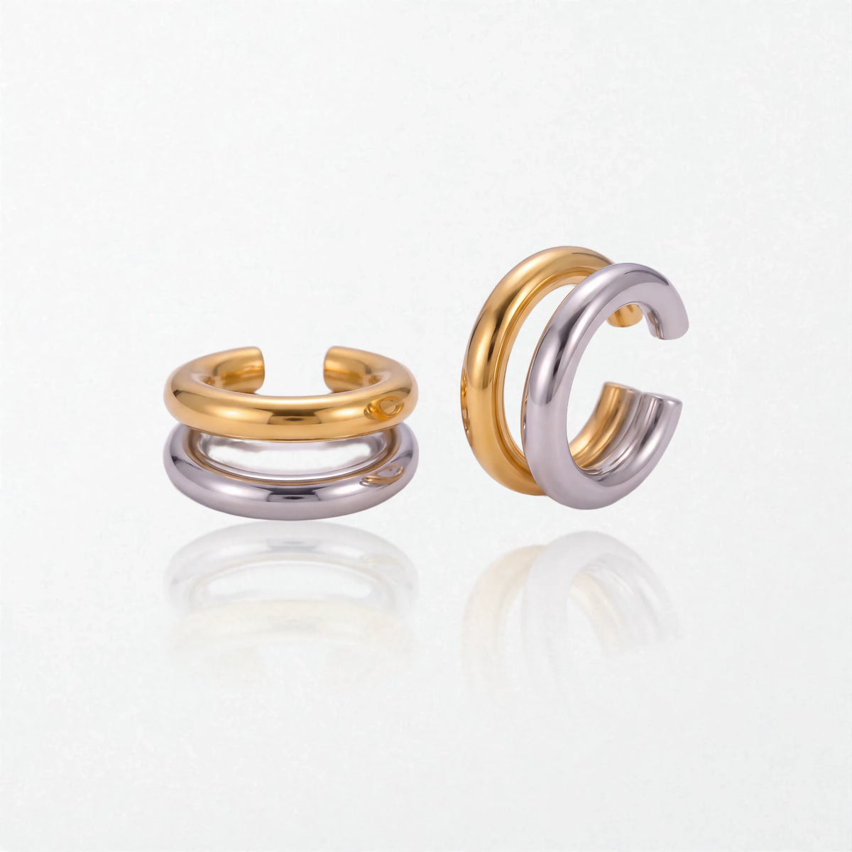 Roxanne mixed metal ear cuffs seen from the side, showing the stacked gold and silver bands