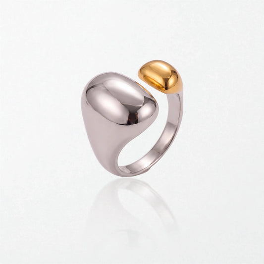 Romy dome ring in duo tone: a large polished silver dome and band with a smaller 18K gold dome