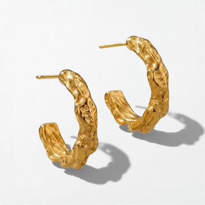 Saga organic molten texture open hoops in a gold PVD finish