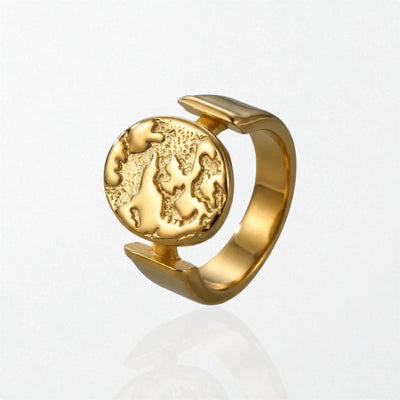 Gaia sculptural globe coin ring in 18K gold-plated waterproof stainless steel, a textured globe disc on a wide open band
