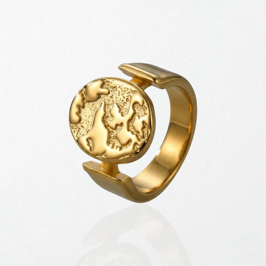 Sculptural statement 18k plated ring with textured globe disc suspended in open band, stainless steel design
