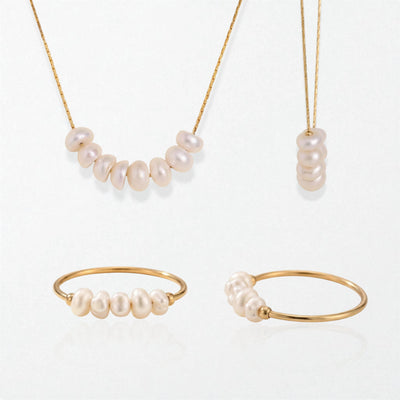 Alva and Astrid pearl set in 18K gold-plated waterproof stainless steel: a pearl cluster necklace and a pearl stacking ring